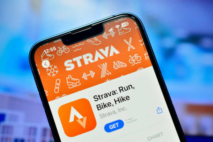 shutterstock_2367362135.jpg Close-up of a smartphone displaying the Strava fitness app