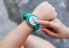Person using a fitness tracker on their wrist