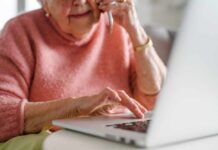 Japan’s Secret to Longer Life Revealed Elderly woman on a phone call while using a laptop