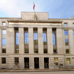 Massive Autism Fraud Scheme Exposed! Facade of a government building with the words Law and Justice and a statue on top