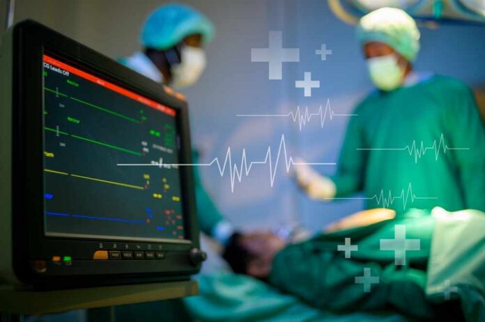 Medical professionals in an operating room monitoring a patient