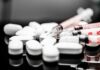 The GLP-1 Trap: Off, On, Repeat White pills and syringes arranged on a reflective surface