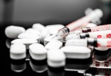 The GLP-1 Trap: Off, On, Repeat White pills and syringes arranged on a reflective surface