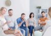 How to Overcome Social Anxiety Support group meeting with participants seated in a circle
