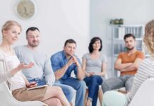 How to Overcome Social Anxiety Support group meeting with participants seated in a circle