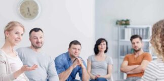 Support group meeting with participants seated in a circle