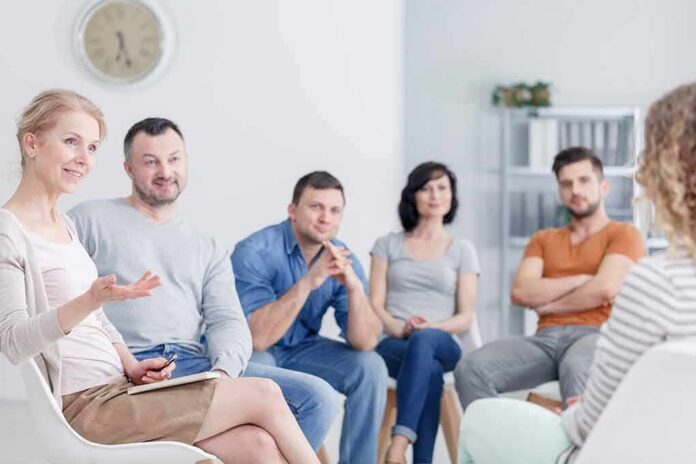 shutterstock_1056944960 Support group meeting with participants seated in a circle