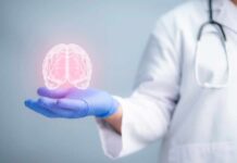 Signs of Early Onset Dementia: What to Look Out For A medical professional holding a glowing digital brain illustration in their hand