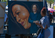 Stress Loops? Try Hands-On Fixes A woman admires a large portrait of a smiling female figure at an outdoor event