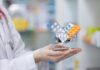 Sleep Aid Fix — Without Melatonin! A doctor holding a miniature shopping cart filled with various medication packs