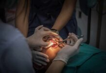 Dental Infections: The Hidden Heart Risk Dental surgeons perform oral procedure with instruments