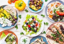 Mediterranean Diet Abandonment Reveals Shifting Nutrition Trends Greek meze spread with salad, olives, pita, and grilled skewers