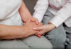 The Silent Epidemic That’s Crippling Middle Age Americans An older persons hand being held by a younger persons hand, symbolizing care and connection