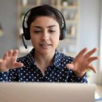 Woman wearing headset on video call