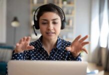 Chatbots Are Changing How People Talk Woman wearing headset on video call