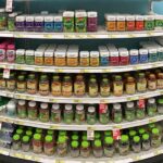 Vitamin and supplement bottles on store shelves