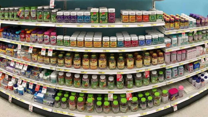 Vitamin and supplement bottles on store shelves