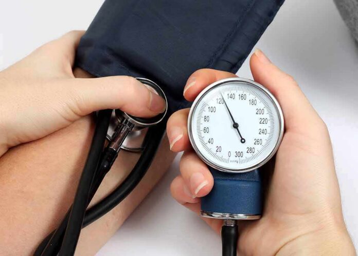 shutterstock_93341521 Blood pressure measurement with sphygmomanometer and stethoscope