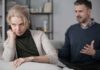 The Joke That Makes Depression Worse Upset woman sitting on couch while man gestures behind her