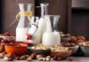 Anti-Aging Milk? Scientists Stunned Glass bottles of milk surrounded by assorted nuts in bowls