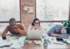 How To Quickly Recover From A Bad Night’s Sleep tired coworkers at a cluttered desk