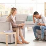 Teen talking with therapist in a bright office
