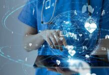 TIME’s List: Most influential HealthTech companies of 2026 Healthcare professional using a digital tablet with medical data icons