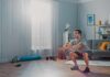 Silent Squat Mistake Wrecking Midlife Knees Man doing bodyweight squats in a living room