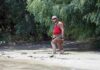 Quicksand Myth SHATTERED – The Waist-High Truth man in red life vest walking through muddy riverbank