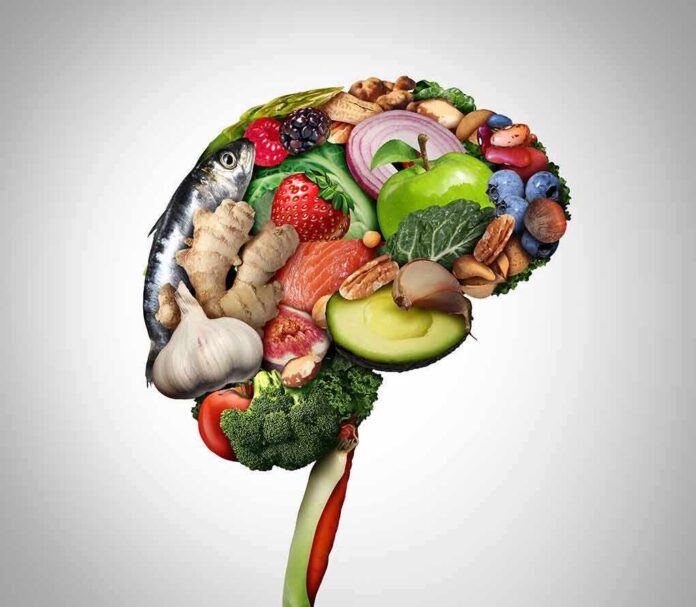 Brain shape made of assorted healthy foods on white background