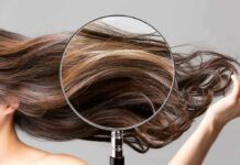 Understanding Hair Thinning and Hair Loss Magnifying glass highlighting long brown hair