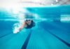 Lake Parasites Vs. Chlorine: Big Mistake swimmer underwater in a lane pool