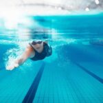 swimmer underwater in a lane pool