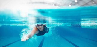 swimmer underwater in a lane pool