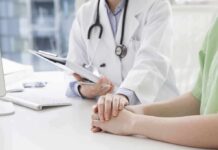Doctors Got Autoimmunity All Wrong Doctor holding a patient's hands during consultation