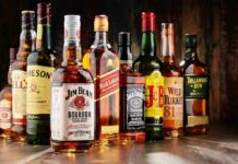 Million New Heavy Drinkers – Same Age Group Assorted whiskey bottles arranged on a wooden surface