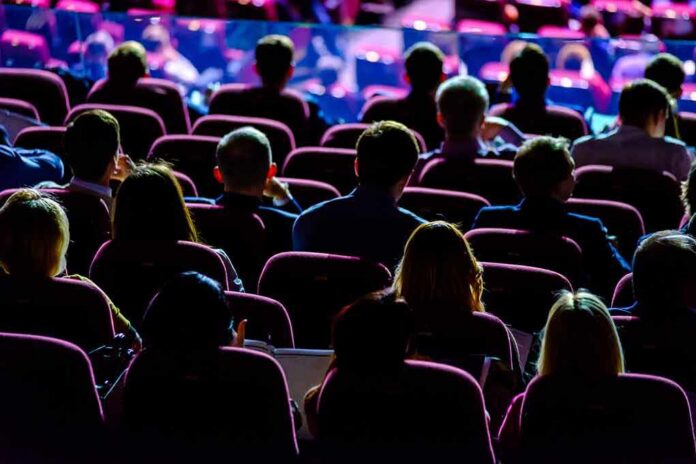 shutterstock_633513077 Audience seated in a theater or conference hall