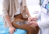 How Stress-Driven Inflammation Reshapes Your Heart doctor showing patient information on a tablet