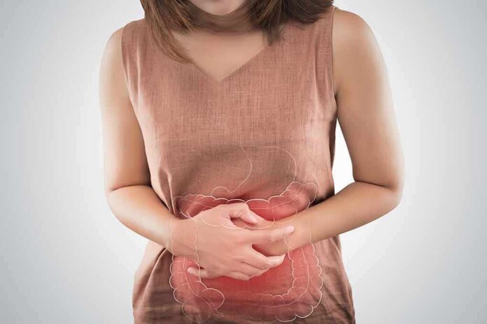 woman holding her stomach in pain with digestive graphic overlay