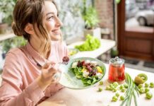 Nature’s Backdoor Into Eating Habits Woman eating a fresh salad at a cafe table