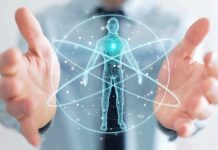 Holographic human figure with orbiting lines between open hands