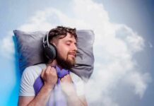 Man sleeping with headphones on a pillow
