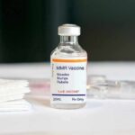 Cancer Vaccine Leak Triggers Wall Street Panic MMR vaccine vial on a white surface