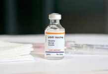 MMR vaccine vial on a white surface