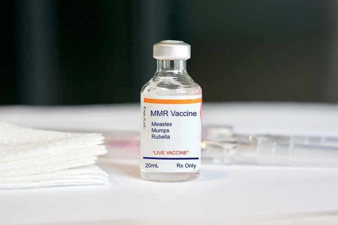 MMR vaccine vial on a white surface