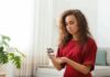 Hidden Non-Diet Culprit Spiking Blood Sugar Woman using a blood glucose meter at home
