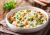 Cold Rice Hack Slashes Sugar Spikes Vegetable rice in a white bowl on a rustic table