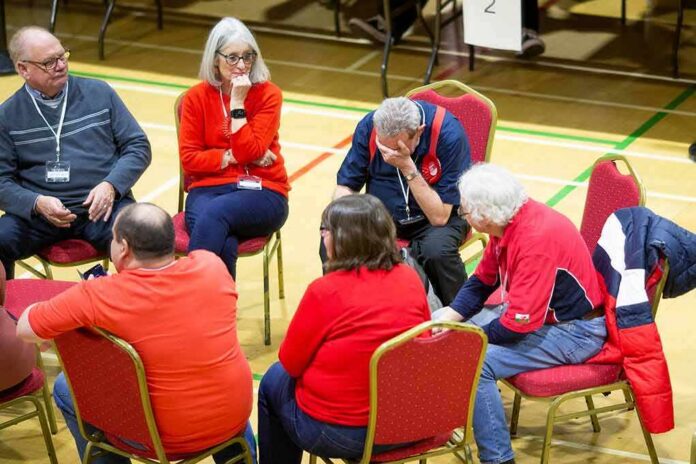Small group of adults seated in a circle during a discussion