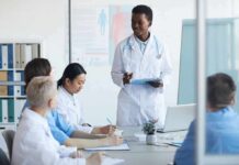 Doctor leading a meeting with medical team in a conference room