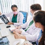 Breathing Plastic? Scientists Sound Alarm Doctors reviewing chest X-ray at a workstation